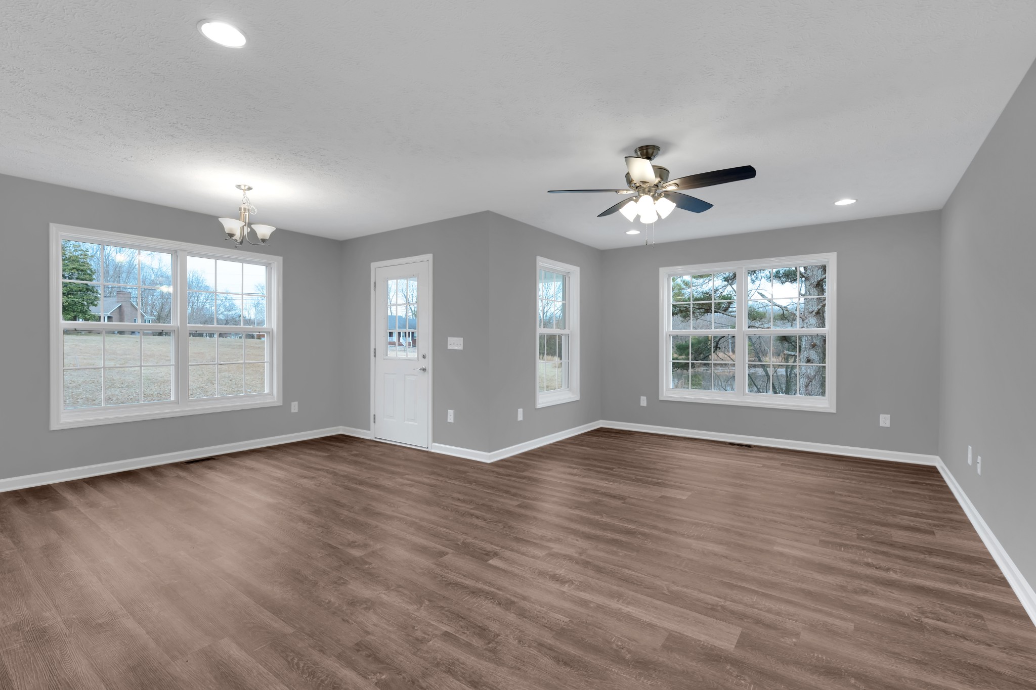 1332 Carter Blake Road Tullahoma, TN 37388 - Photo 2 of 31 a view of an empty room with wooden floor and a window