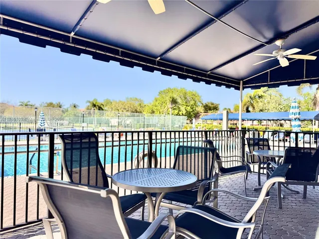 a room with gym equipment and windows