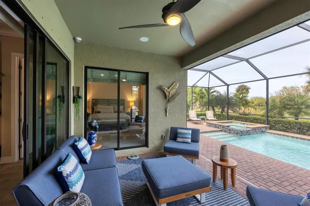 a view of swimming pool with a patio and a yard