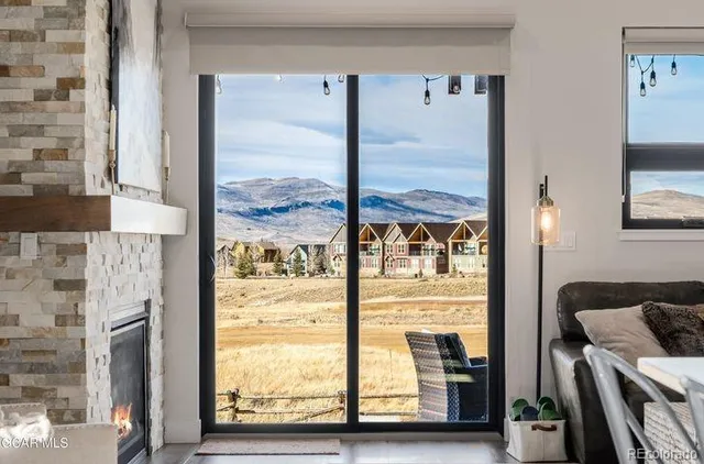 a view of a living room with a large window