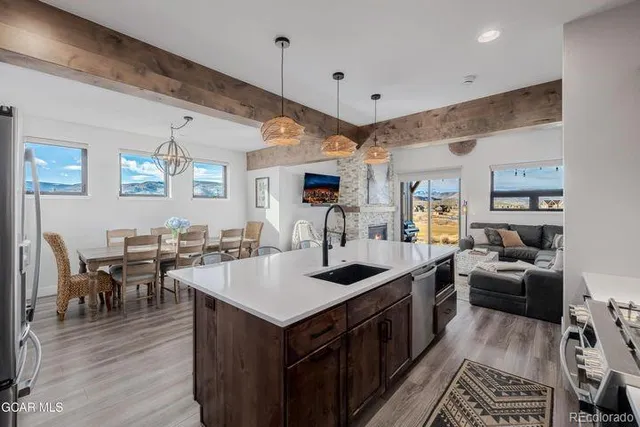a kitchen with stainless steel appliances granite countertop a stove and a refrigerator