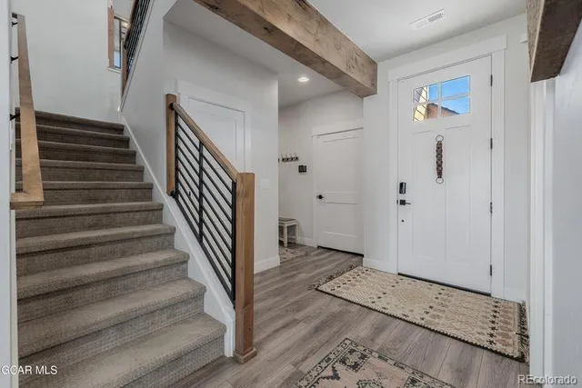 a view of entryway with wooden floor