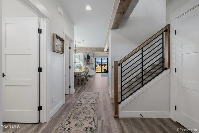 a view of a hallway view with staircase