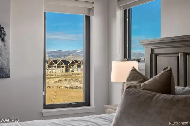 a view of a hallway with windows