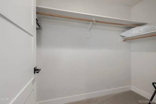 a view of a room with racks on the wall