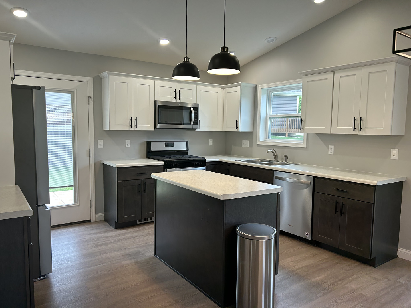 35 Winding Way Bloomington, IL 61705 - Photo 2 of 9 a kitchen with a sink stove a microwave and cabinets