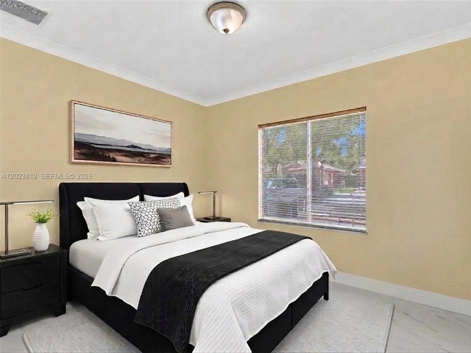2864 Southwest 138th Path Miami, FL 33175 - Photo 26 of 40 a bedroom with a bed and a painting on the wall