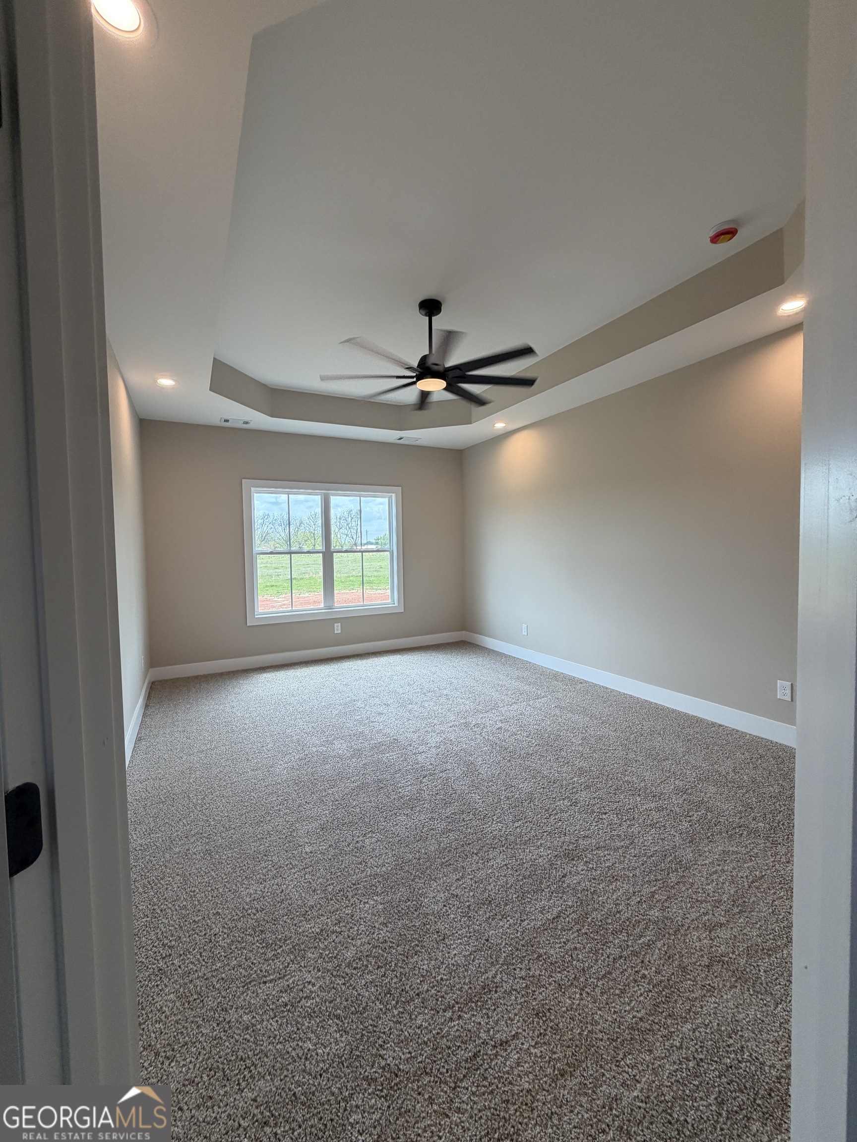 54 Melville Brown Road Williamson, GA 30292 - Photo 6 of 16 a view of a livingroom with a ceiling fan and window