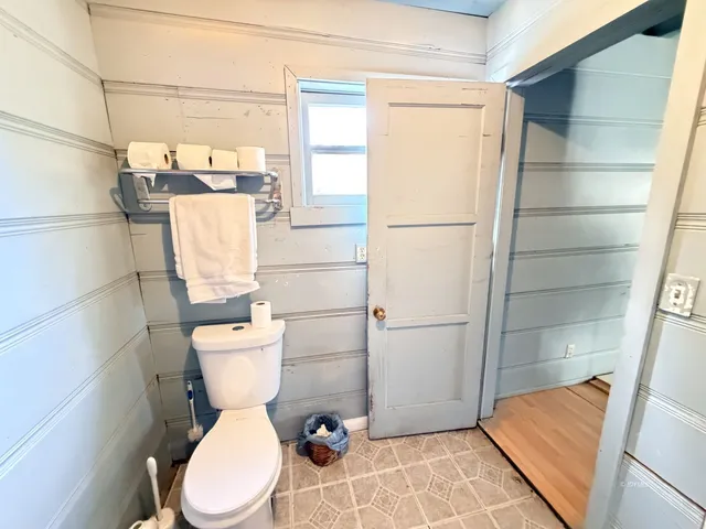 a bathroom with a toilet and a sink