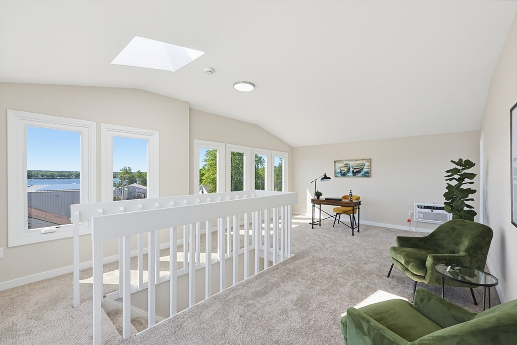 45 Main Street, Unit 35 Wareham, MA 02571 - Photo 25 of 34 a living room with furniture and a large window