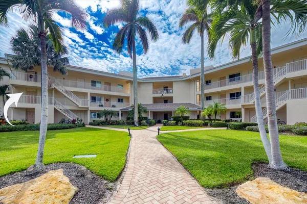 a front view of a building with garden
