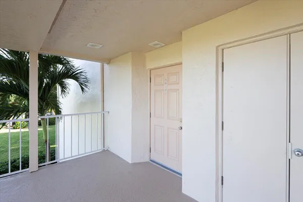 a view of a swimming pool with a patio and a yard