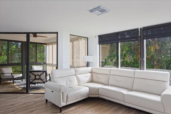 a living room with furniture and a large window