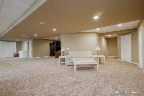 a living room with furniture and a lamp