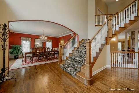a view of entryway dining room and hall with wooden floor