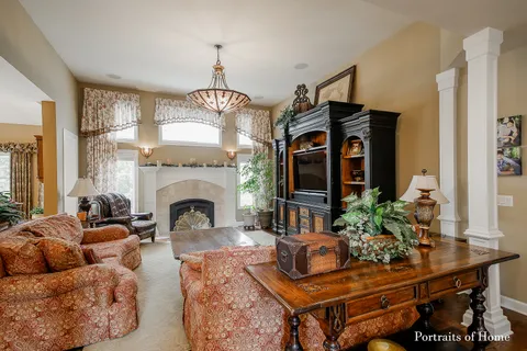 a living room with furniture fireplace and flat screen tv