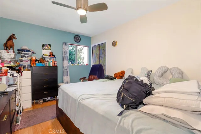 a bed room with a bed and a chandelier