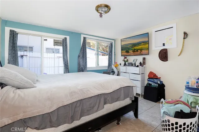 a bedroom with a bed and cabinets