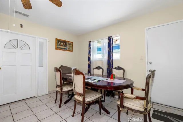 a view of a dining room with furniture and a table