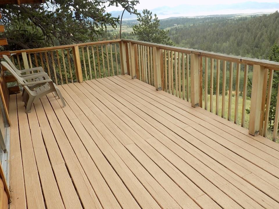 419 Osprey Road Como, CO 80432 - Photo 3 of 31 a balcony with wooden floor and trees in the background
