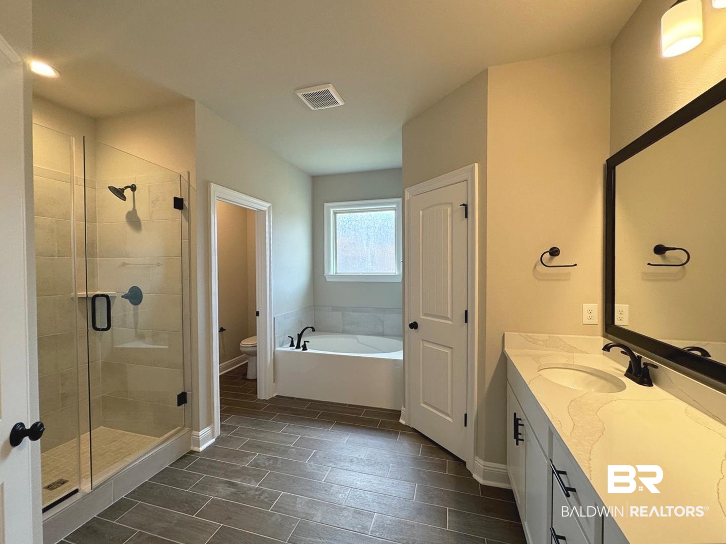 888 Sumter Loop Foley, AL 36535 - Photo 5 of 8 Full bathroom with vanity, toilet, and independent shower and bath