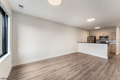 a view of kitchen with wooden floor