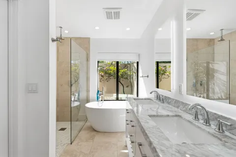 a utility room with sink dryer and washer