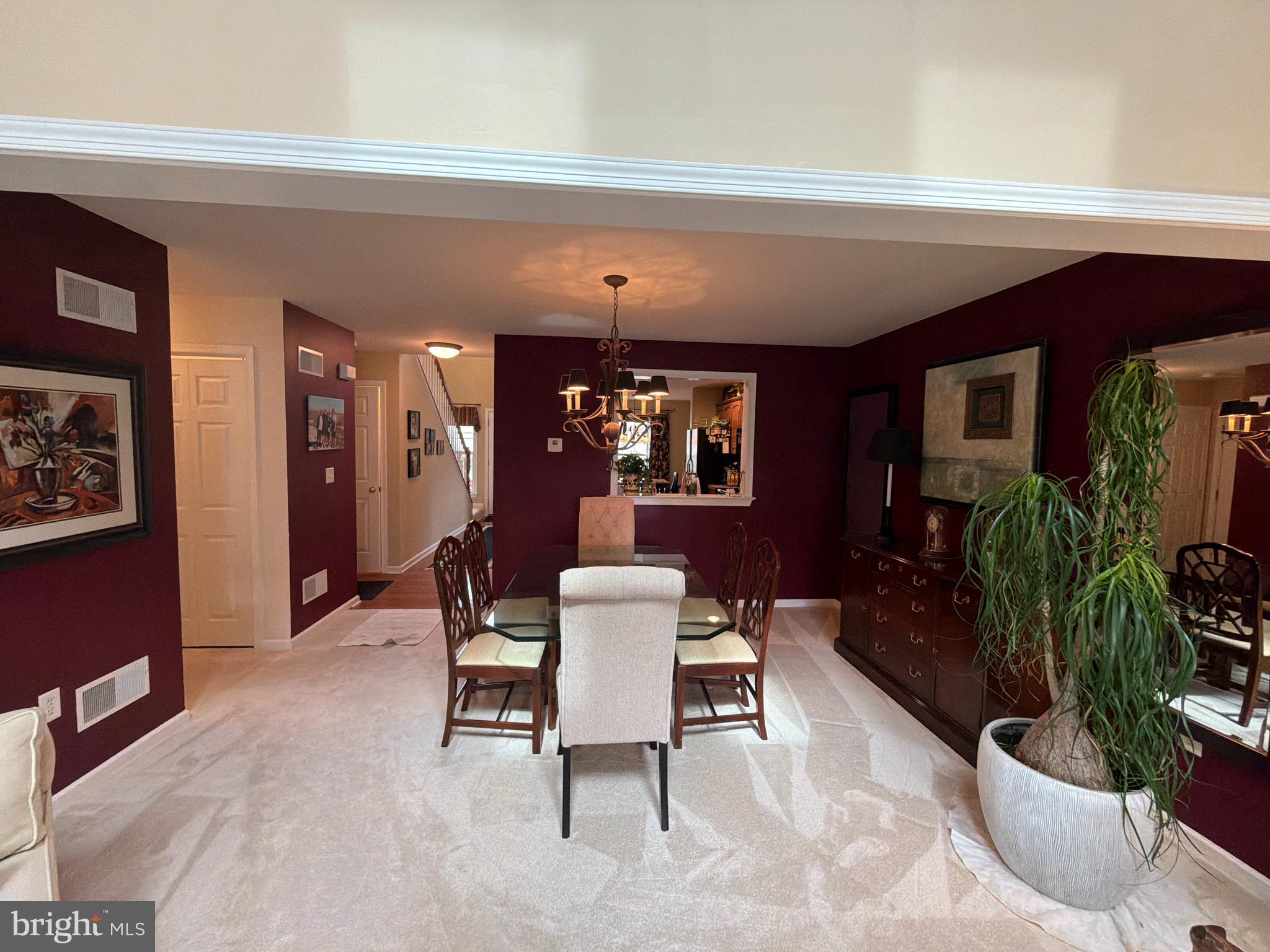 4245 Roth Farm Village Circle Mechanicsburg, PA 17050 - Photo 12 of 42 a living room with furniture and potted plants