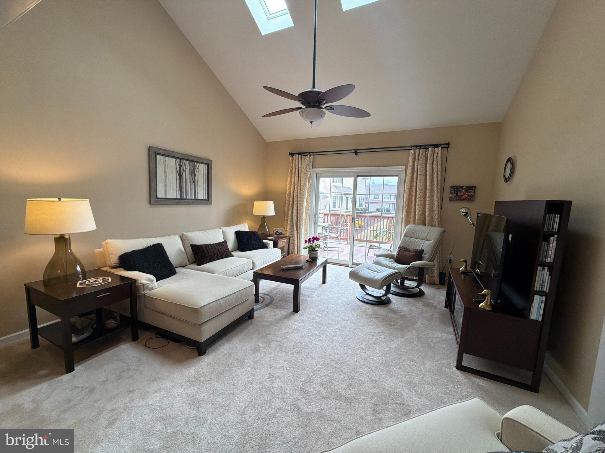 4245 Roth Farm Village Circle Mechanicsburg, PA 17050 - Photo 13 of 42 a living room with furniture and a chandelier