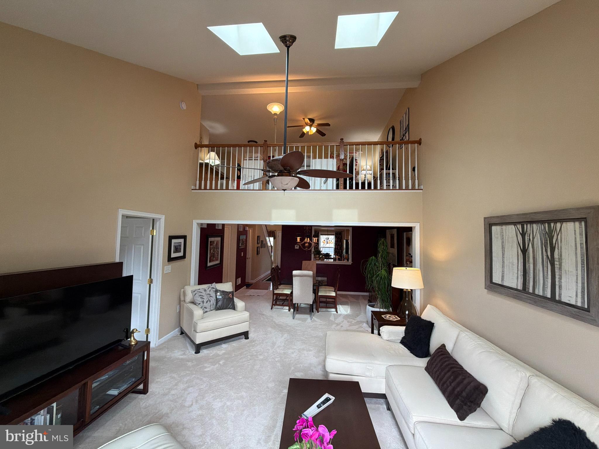 4245 Roth Farm Village Circle Mechanicsburg, PA 17050 - Photo 16 of 42 a living room with furniture and a flat screen tv