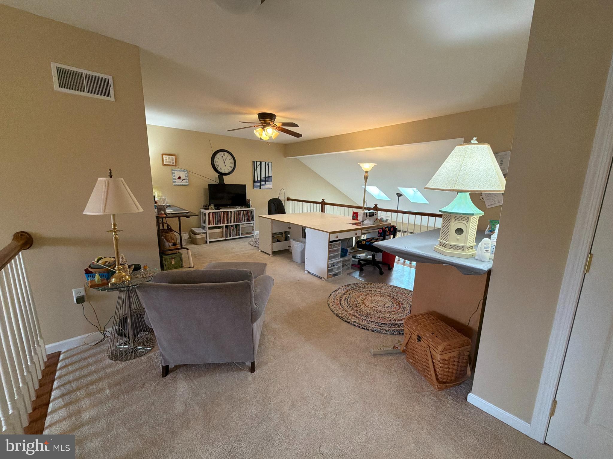 4245 Roth Farm Village Circle Mechanicsburg, PA 17050 - Photo 25 of 42 a living room with furniture and a table