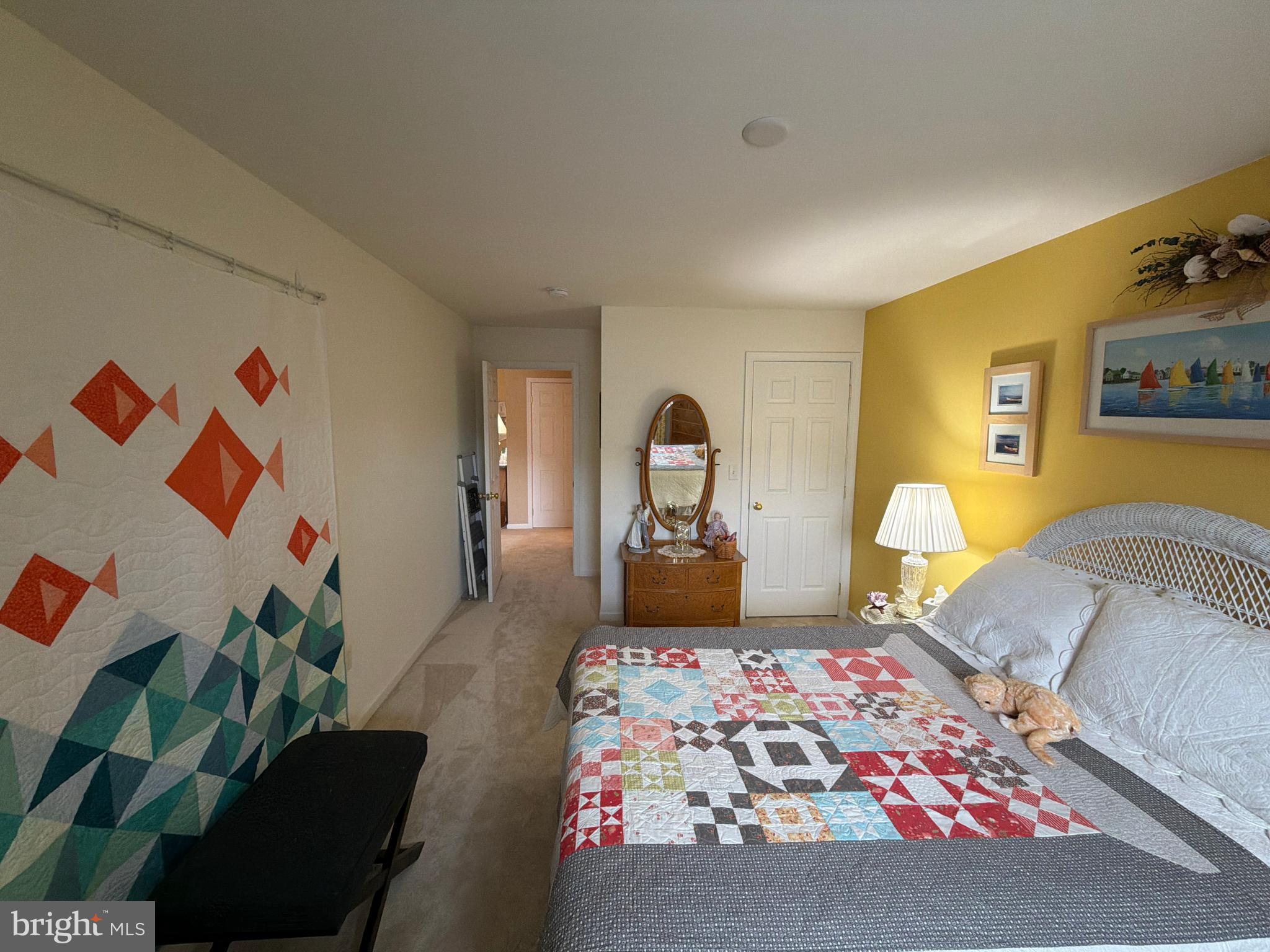 4245 Roth Farm Village Circle Mechanicsburg, PA 17050 - Photo 30 of 42 a bedroom with a bed and a lamp on dresser