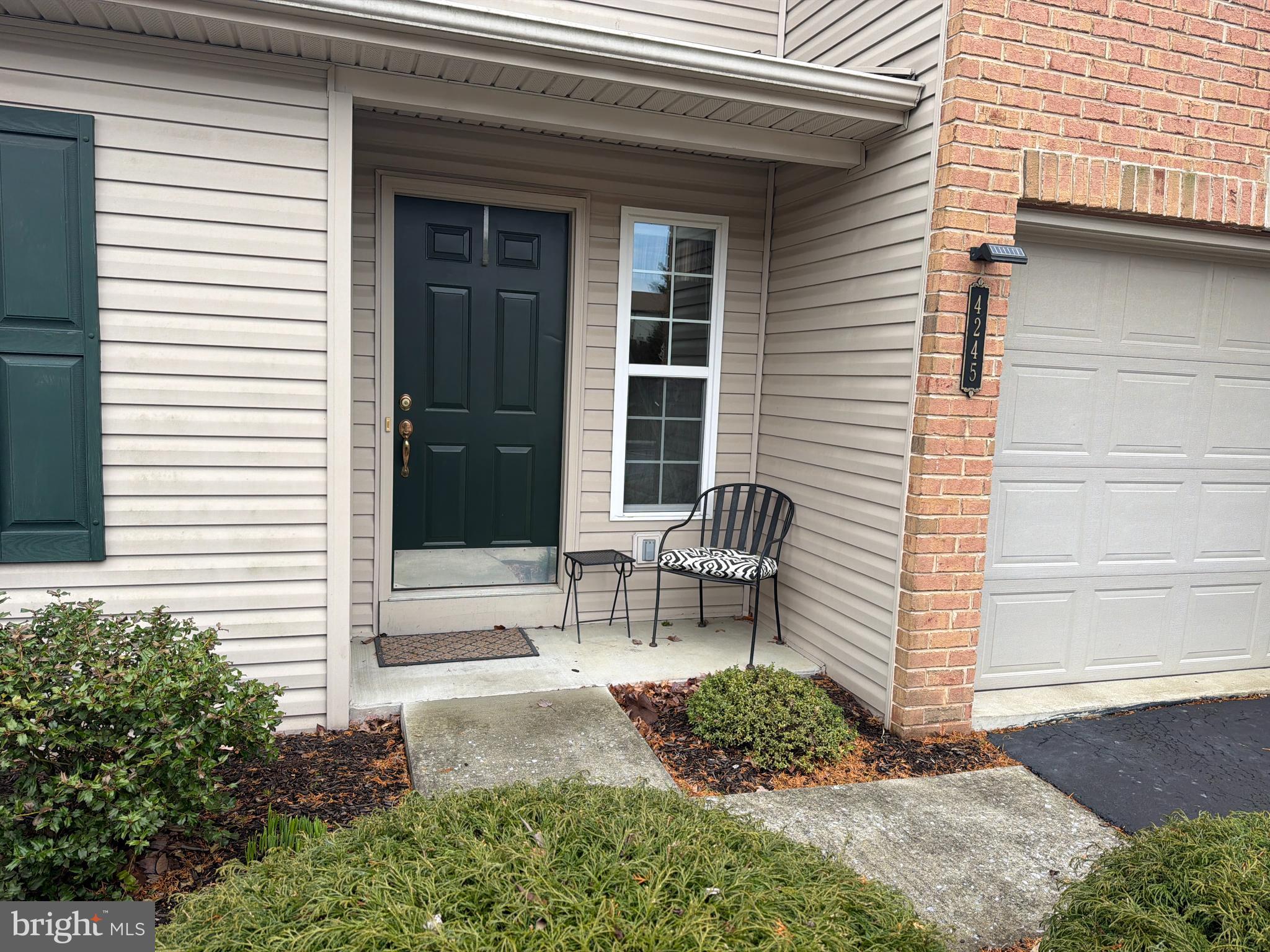4245 Roth Farm Village Circle Mechanicsburg, PA 17050 - Photo 3 of 42 a view of a bench in back of the house