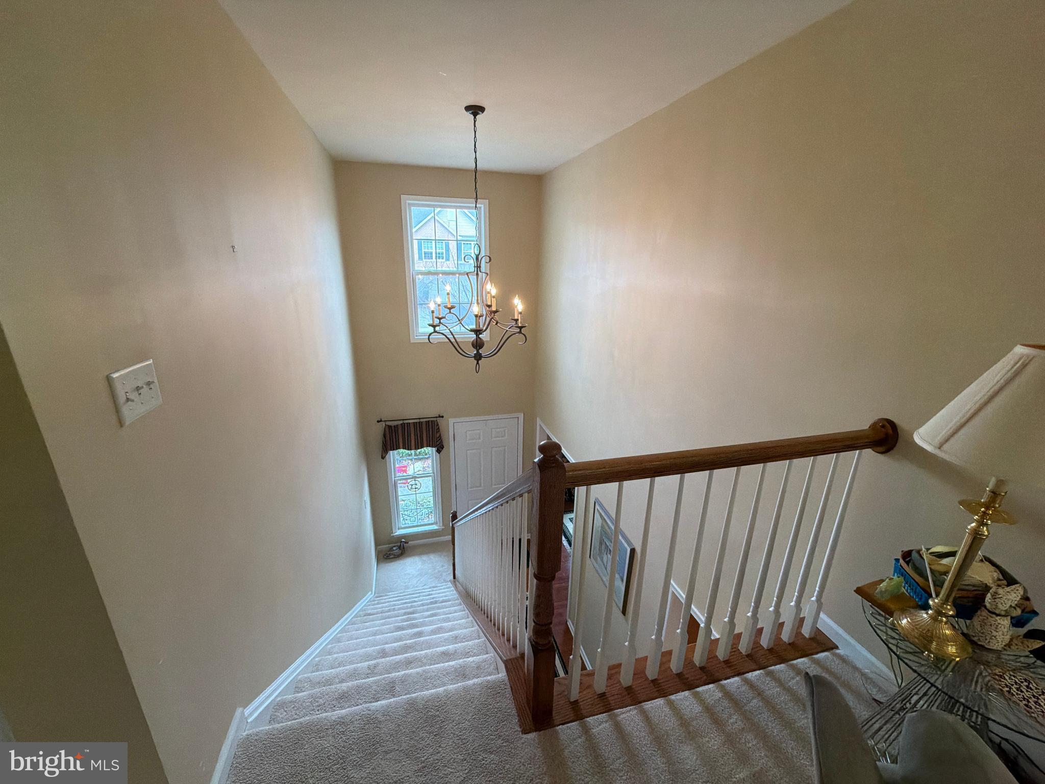 4245 Roth Farm Village Circle Mechanicsburg, PA 17050 - Photo 34 of 42 a view of hallway with furniture and chandelier
