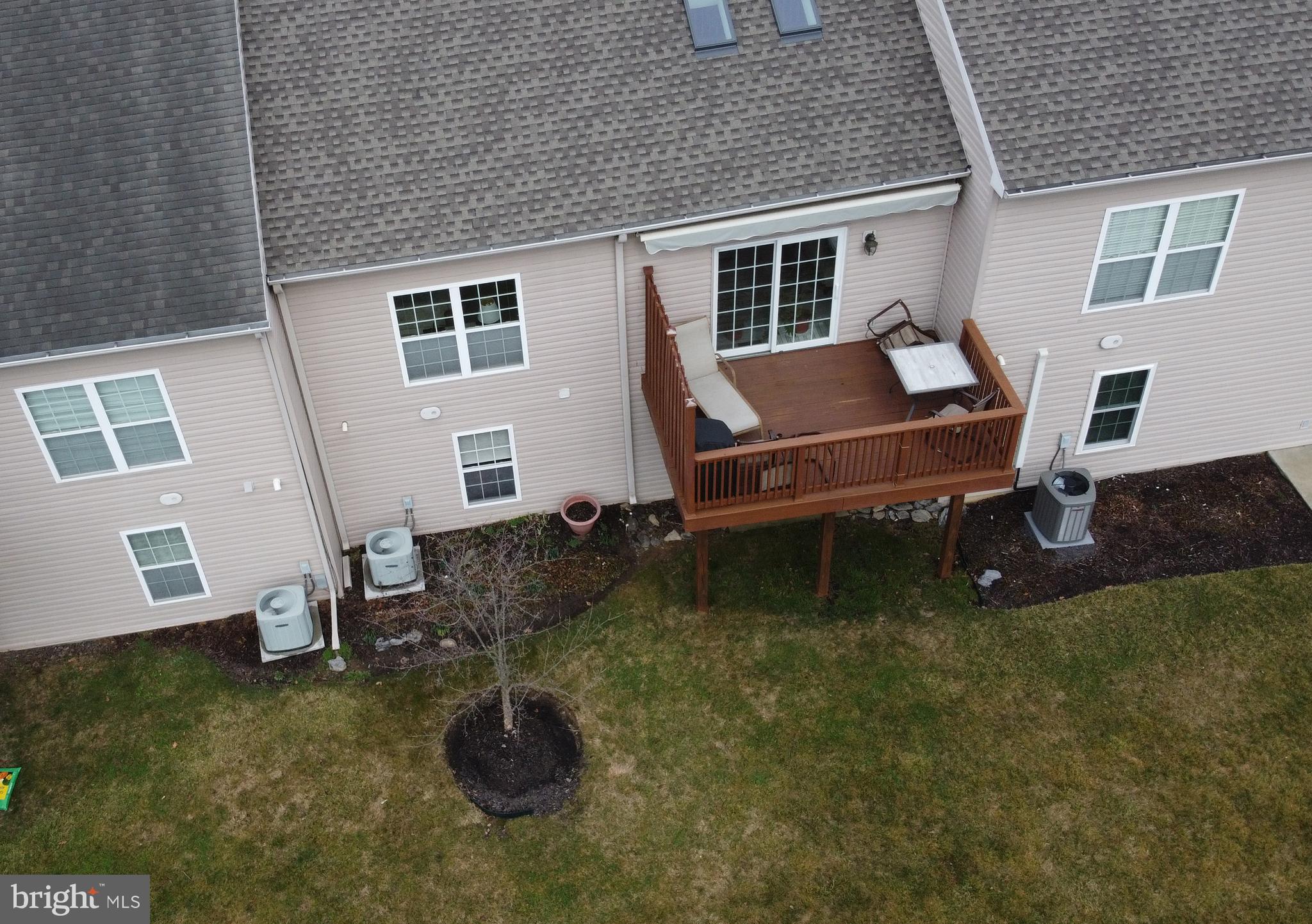4245 Roth Farm Village Circle Mechanicsburg, PA 17050 - Photo 35 of 42 a backyard of a house with seating space
