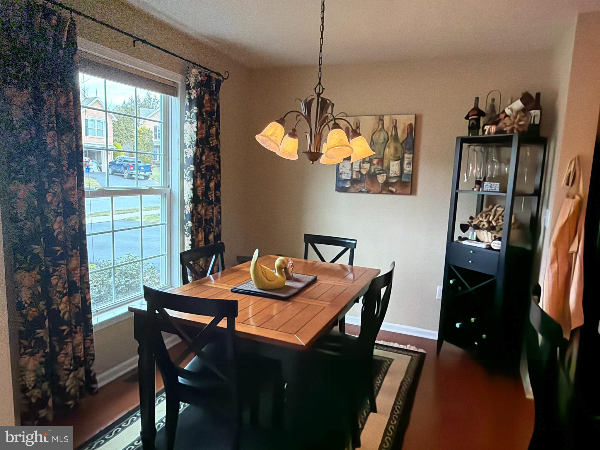 4245 Roth Farm Village Circle Mechanicsburg, PA 17050 - Photo 5 of 42 a view of a dining room with furniture window and outside view