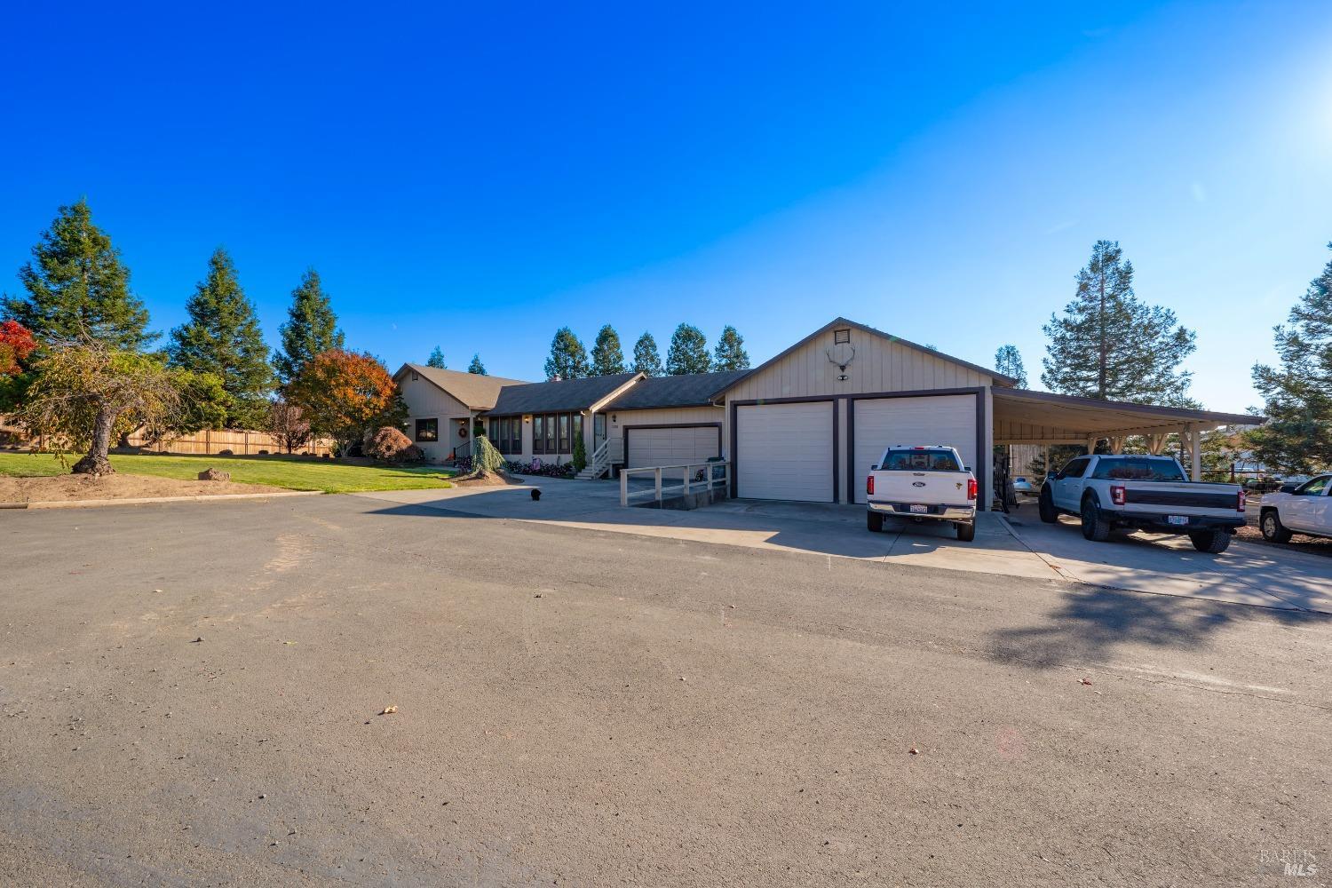 2208 Olivet Road Santa Rosa, CA 95401 - Photo 52 of 65 a front view of a house with a garden and parking