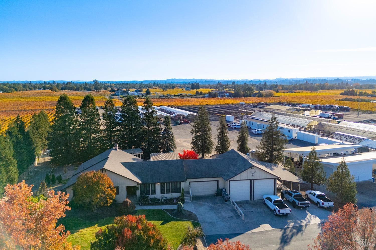 2208 Olivet Road Santa Rosa, CA 95401 - Photo 63 of 65 an aerial view of a house with outdoor space and lake view in back
