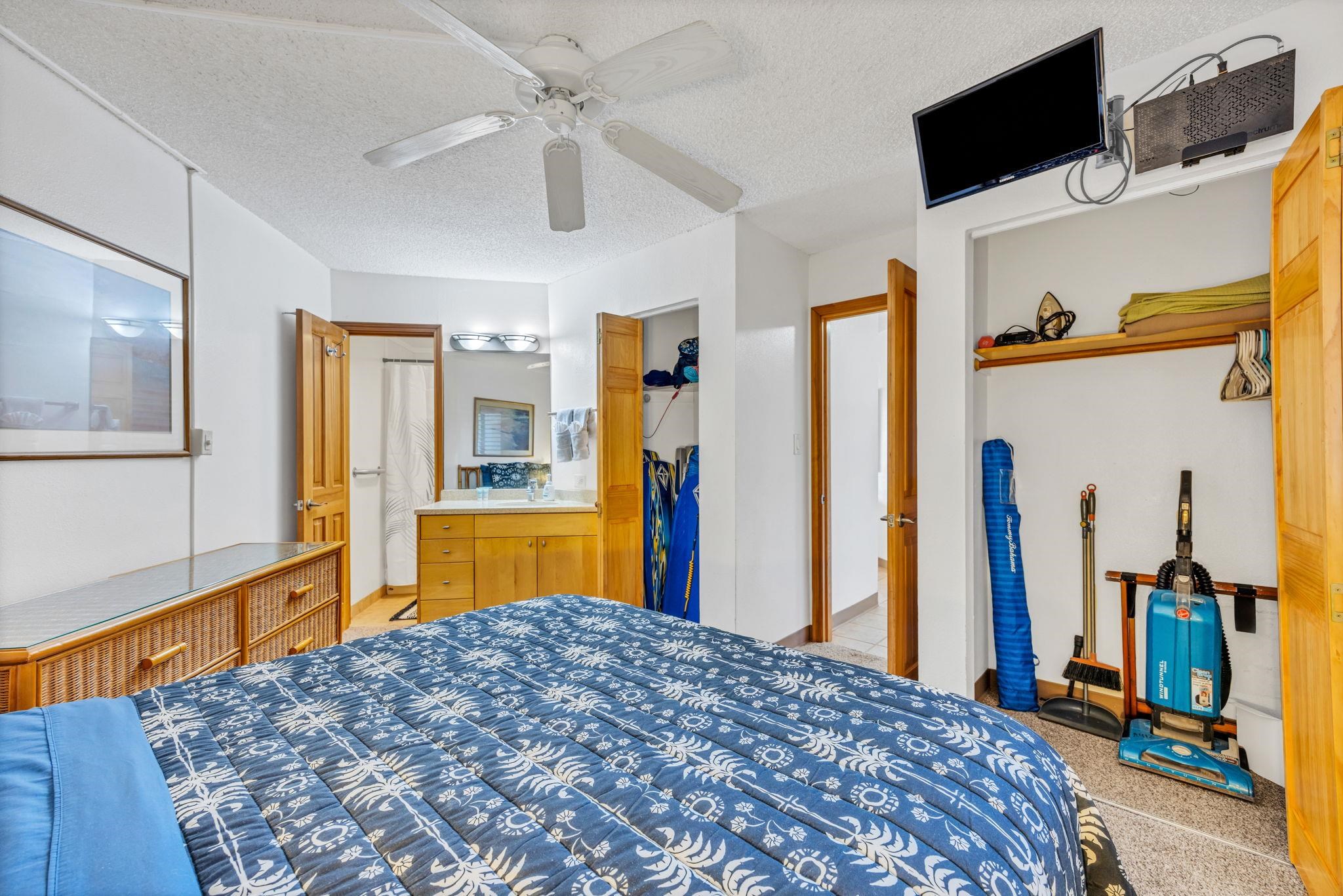 1032 South Kihei Road, Unit A412 Kihei, HI 96753 - Photo 17 of 43 a bedroom with a bed and a flat tv screen on dresser