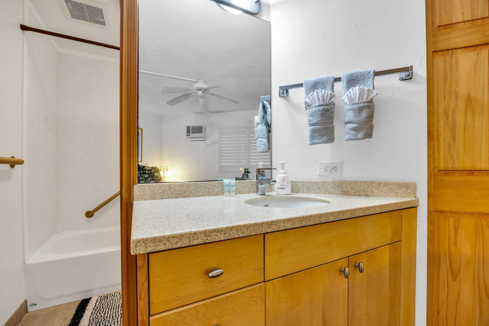 1032 South Kihei Road, Unit A412 Kihei, HI 96753 - Photo 23 of 43 a bathroom with a sink and a mirror