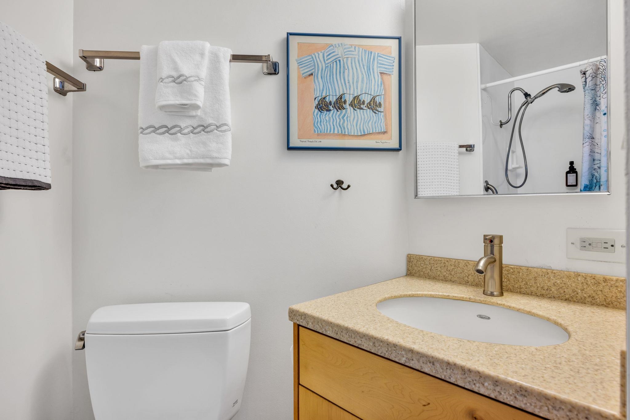 1032 South Kihei Road, Unit A412 Kihei, HI 96753 - Photo 25 of 43 a bathroom with a granite countertop sink a toilet and shower