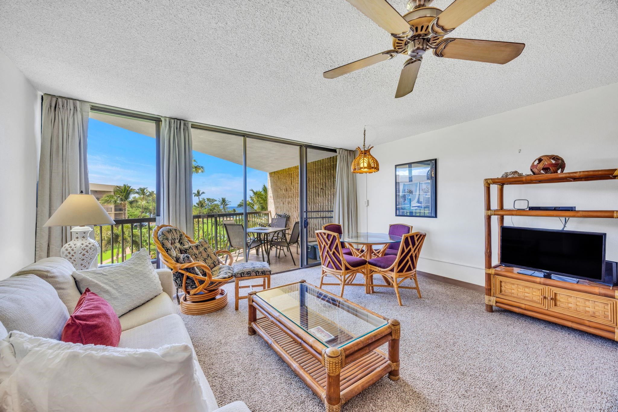 1032 South Kihei Road, Unit A412 Kihei, HI 96753 - Photo 4 of 43 a living room with furniture and a flat screen tv