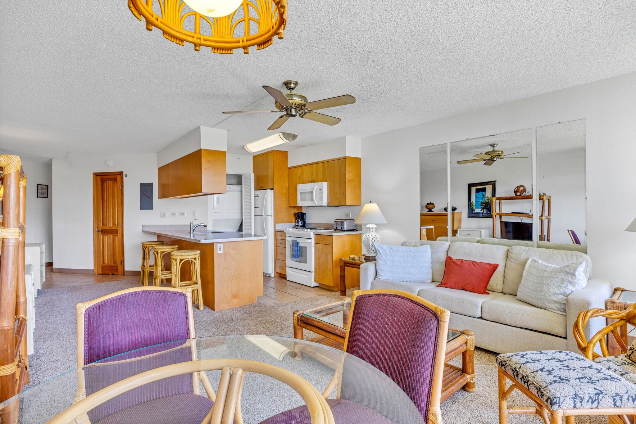1032 South Kihei Road, Unit A412 Kihei, HI 96753 - Photo 5 of 43 a living room with fireplace furniture and a flat screen tv