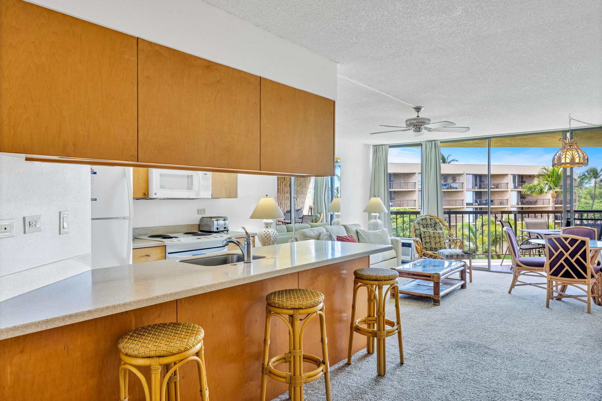 1032 South Kihei Road, Unit A412 Kihei, HI 96753 - Photo 10 of 43 a very nice looking kitchen with a large window appliances and furniture