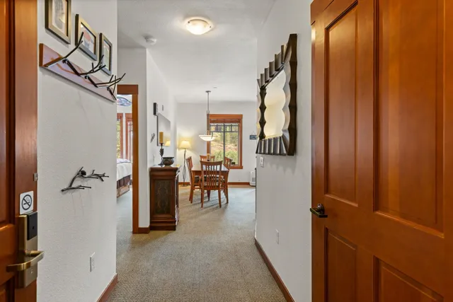 a view of a livingroom with furniture and stairs
