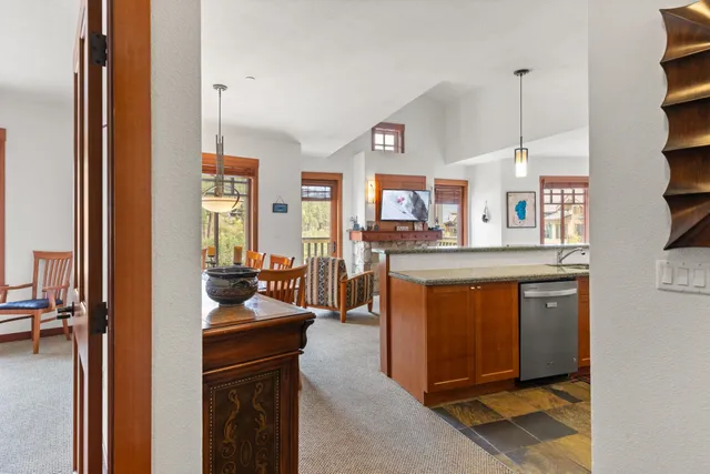a kitchen with stainless steel appliances granite countertop a refrigerator and a stove