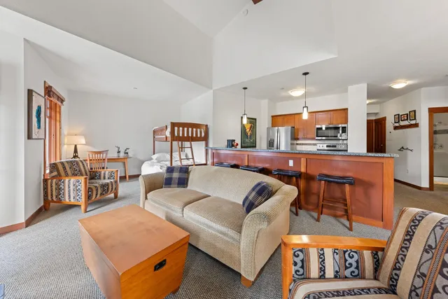 a living room with furniture and a table