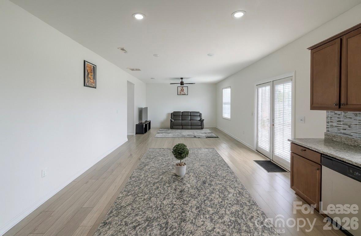 1266 Nesters Store Place Southwest Concord, NC 28027 - Photo 11 of 30 a living room with a couch and a stove top oven