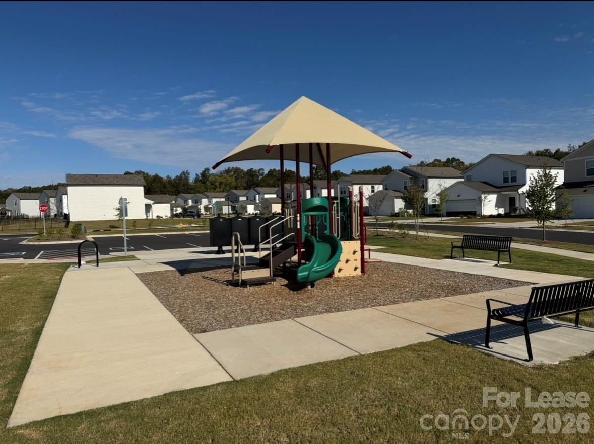 1266 Nesters Store Place Southwest Concord, NC 28027 - Photo 27 of 30 a view of a swimming pool with chairs in patio