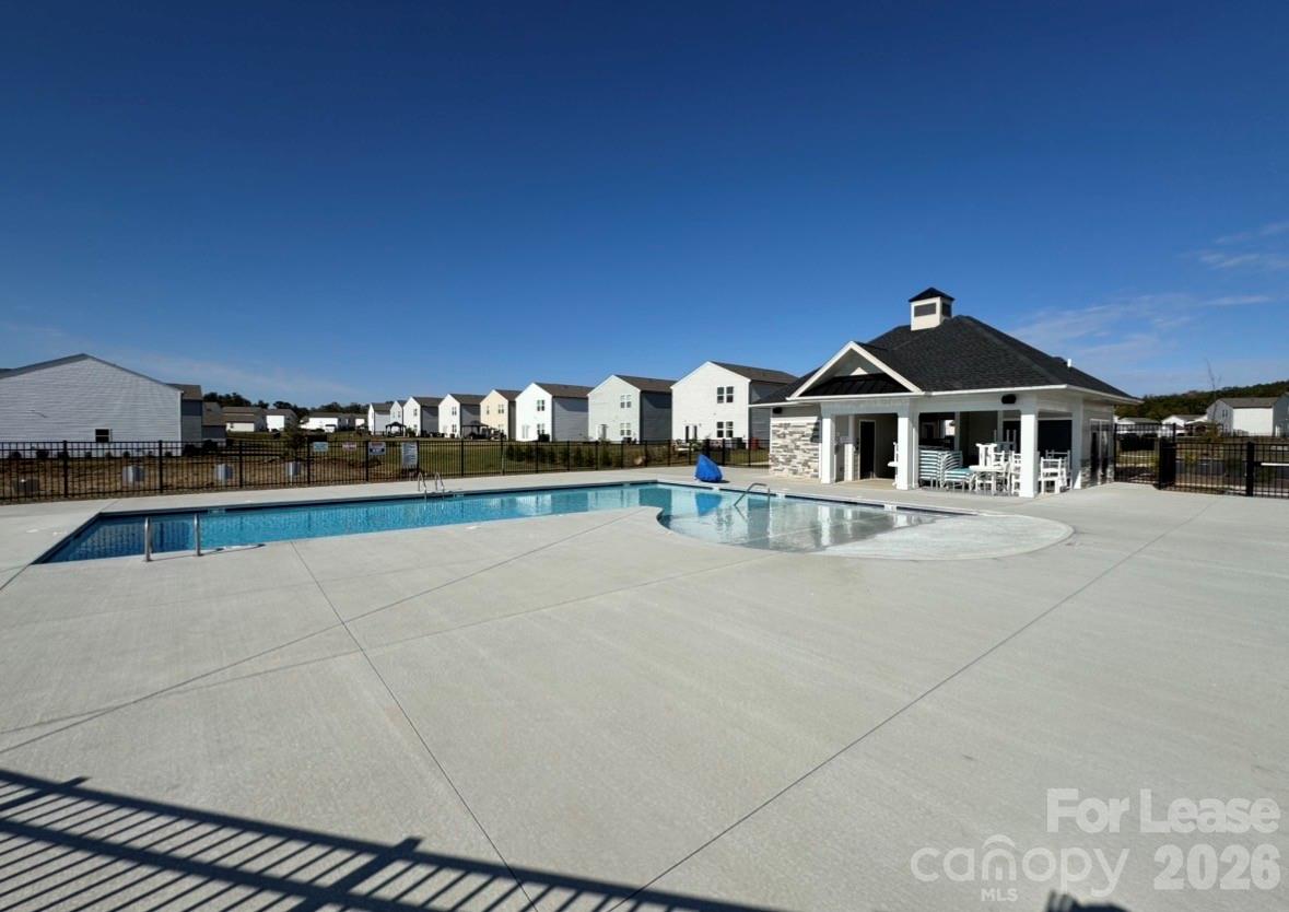 1266 Nesters Store Place Southwest Concord, NC 28027 - Photo 28 of 30 a front view of a house with a yard